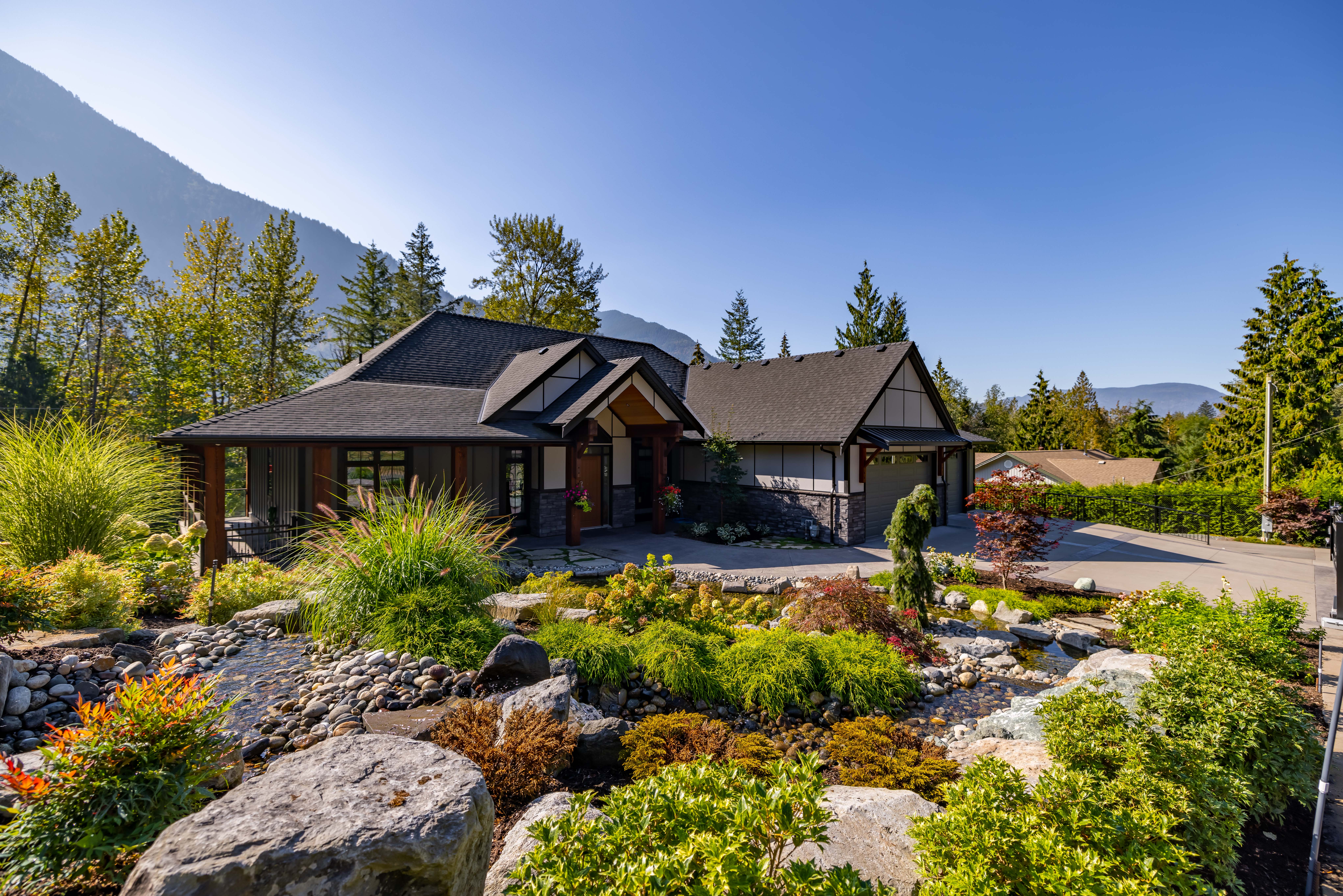 Thoughtfully designed residential garden with layered planting, pathways and outdoor living areas